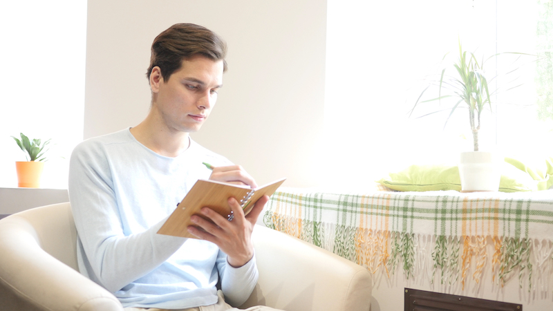 Bigstock Man Writing Notes With Elegant 201054166