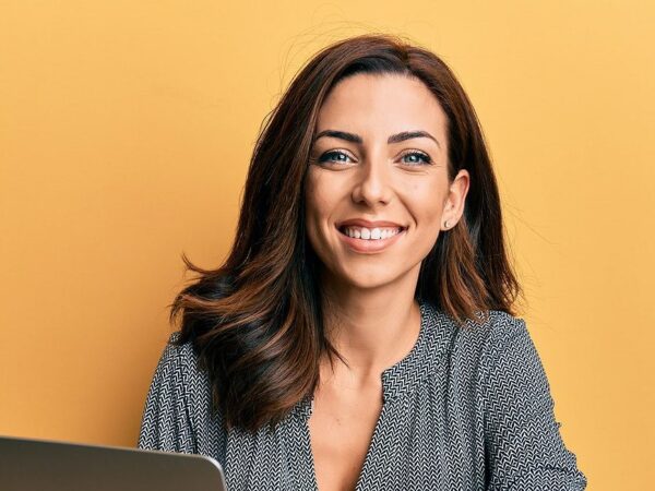 Resized Bigstock Young Brunette Woman Working U 414954221 E1624658461613