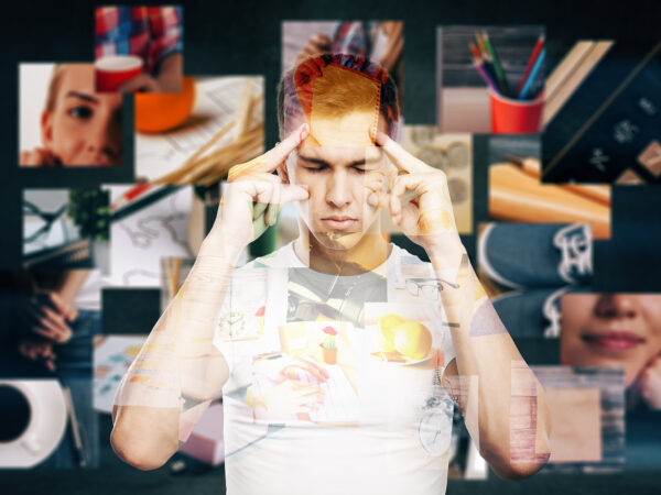 Young man thinking about life with thought images aroud him on dark background