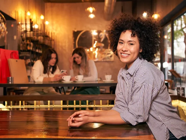 Woman Leaning Table