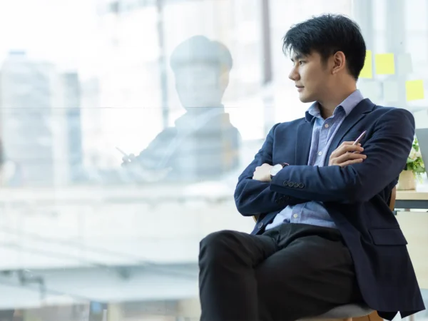 Man Looking Out Window
